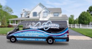 Three Way Plumbing service truck parked in front of a large white home.