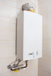 tankless water heater attached to wall in a home
