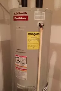 Tank-style water heater in home