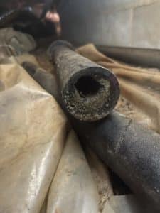 photo of clogged pipe in home's basement