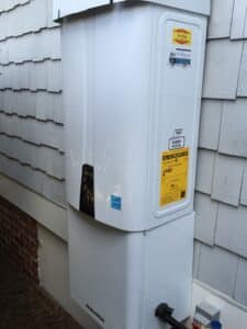 tankless water heater on the outside of a house